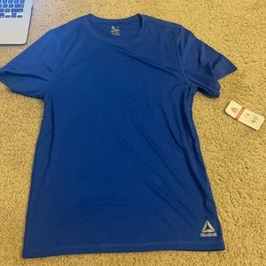 Men’s size M blue Reebok athletic shirt - Never warn with tags.